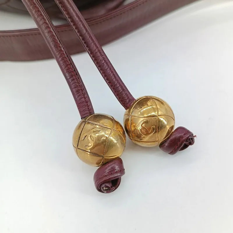 ra742-chanel-vintage-burgundy-lambskin-golden-ball-mini-bucket-bag
