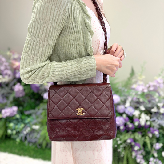 C663 - CHANEL Vintage Twisted Strap Burgundy Lambskin Flap Bag